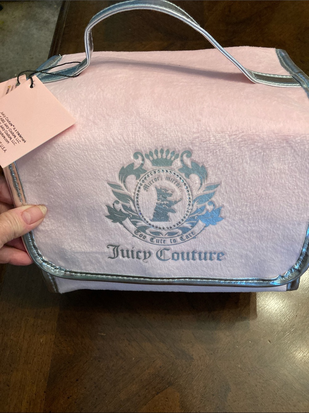 NWT Juicy Couture Pink Cosmetic Case with Silver Trim and Crest. Has 4 pockets